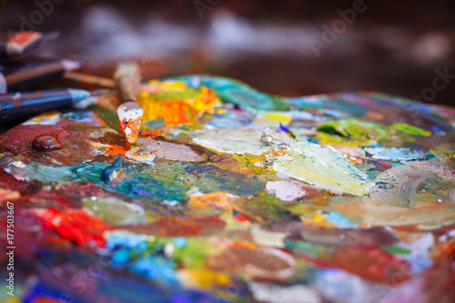 The palette of oil paints close up