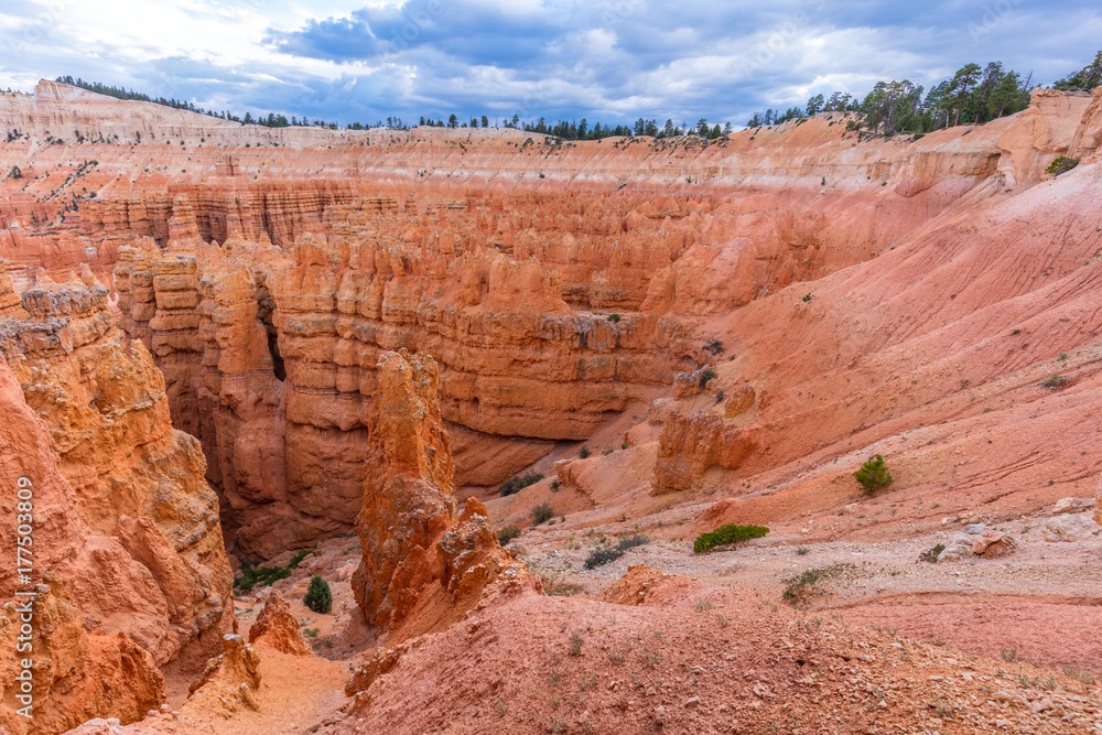 Spectacular view at the cliffs and cloud sky. Amazing mountain landscape. Breathtaking view of the canyon. Bryce Canyon National Park. Utah. USA Spectacular view at the cliffs and cloud sky. Amazing mountain landscape. Breathtaking view of the canyon. Bryce Canyon National Park. Utah. USA