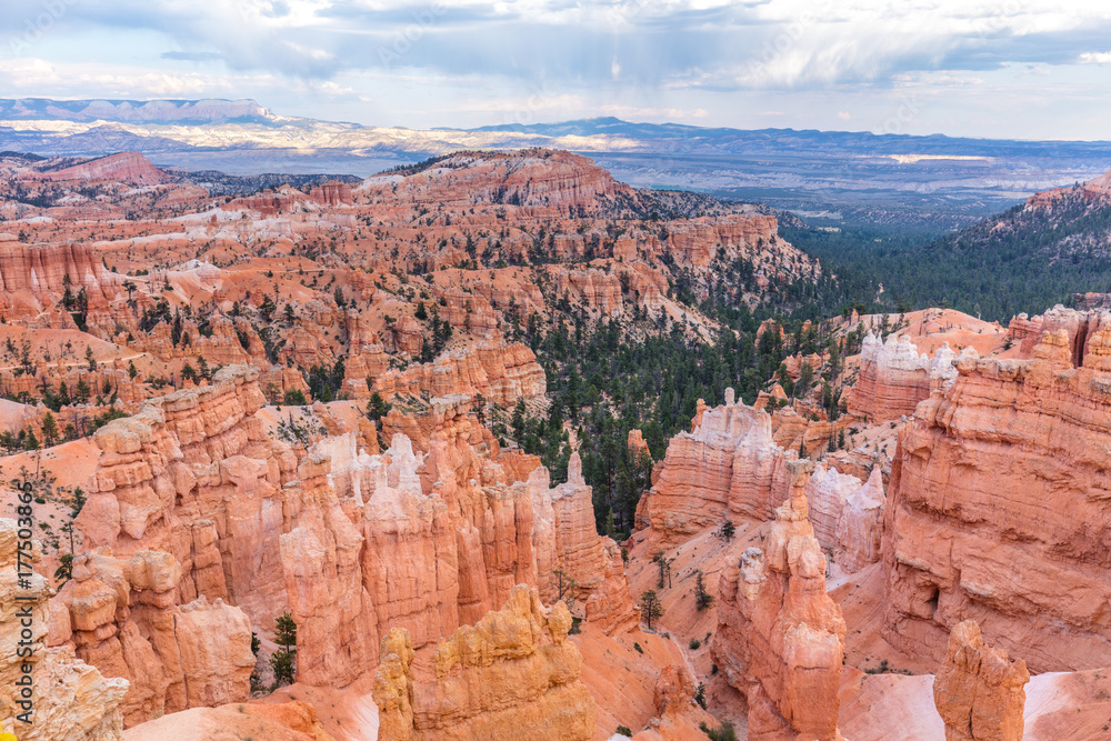 Spectacular view at the cliffs and cloud sky. Amazing mountain landscape. Breathtaking view of the canyon. Bryce Canyon National Park. Utah. USA Spectacular view at the cliffs and cloud sky. Amazing mountain landscape. Breathtaking view of the canyon. Bryce Canyon National Park. Utah. USA
