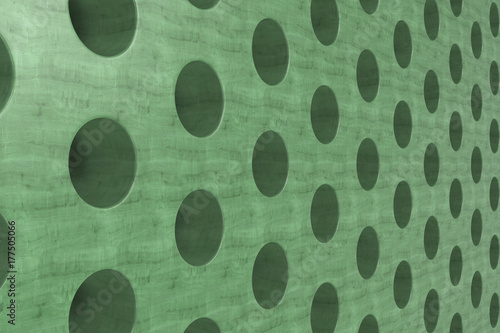 Plain green wooden surface with cylindrical holes photo