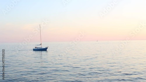 Toronto, ON, Canada - September 23, 2017 - short video of sunset on Lake Ontario with sailboat speedboats and jetskies photo