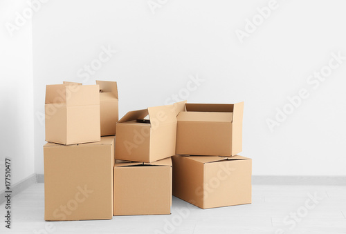 Move house concept. Carton boxes on floor in empty room