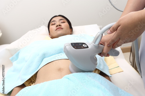 Treatment on Asian Woman as patient to make skin smooth bright photo