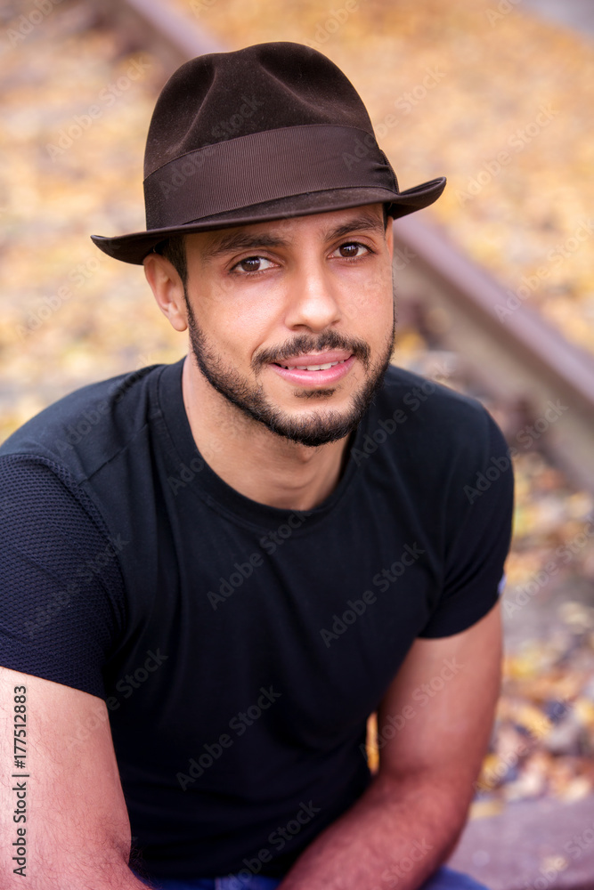 portrait of handsome young man with hat portrait of handsome young man with hat