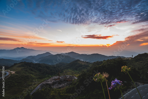 Beautiful sunrise over layers of mountain photo