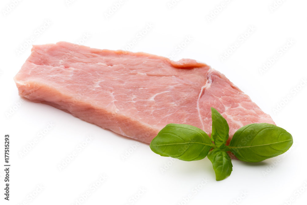 Fresh pork fillet with basil on a white background. Fresh pork fillet with basil on a white background.