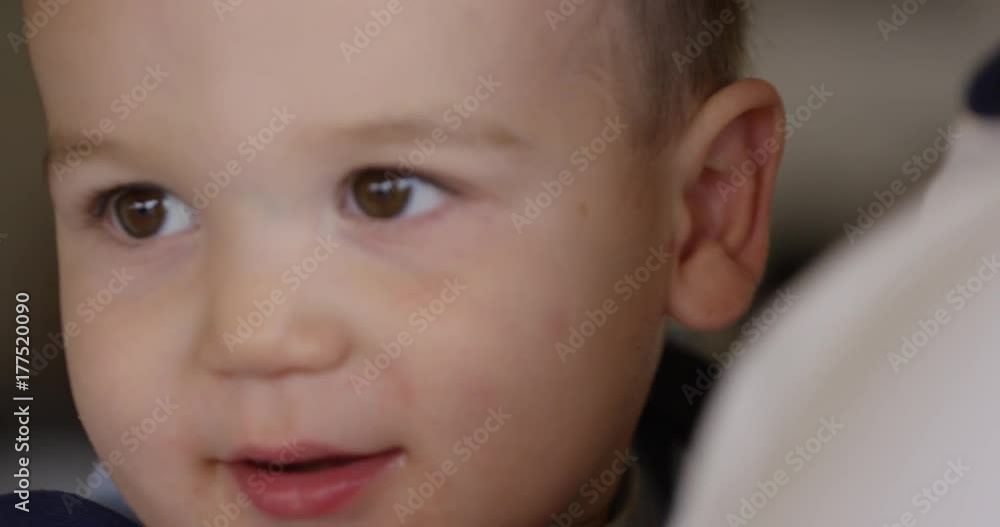 Infant boy in father arms cheerful - close up Infant boy in father arms cheerful - close up