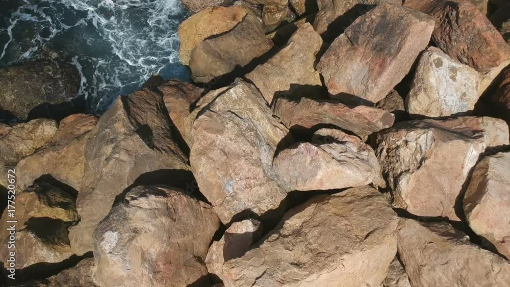 Bird's Eye View Over rocks And Sea Water Bird's Eye View Over rocks And Sea Water