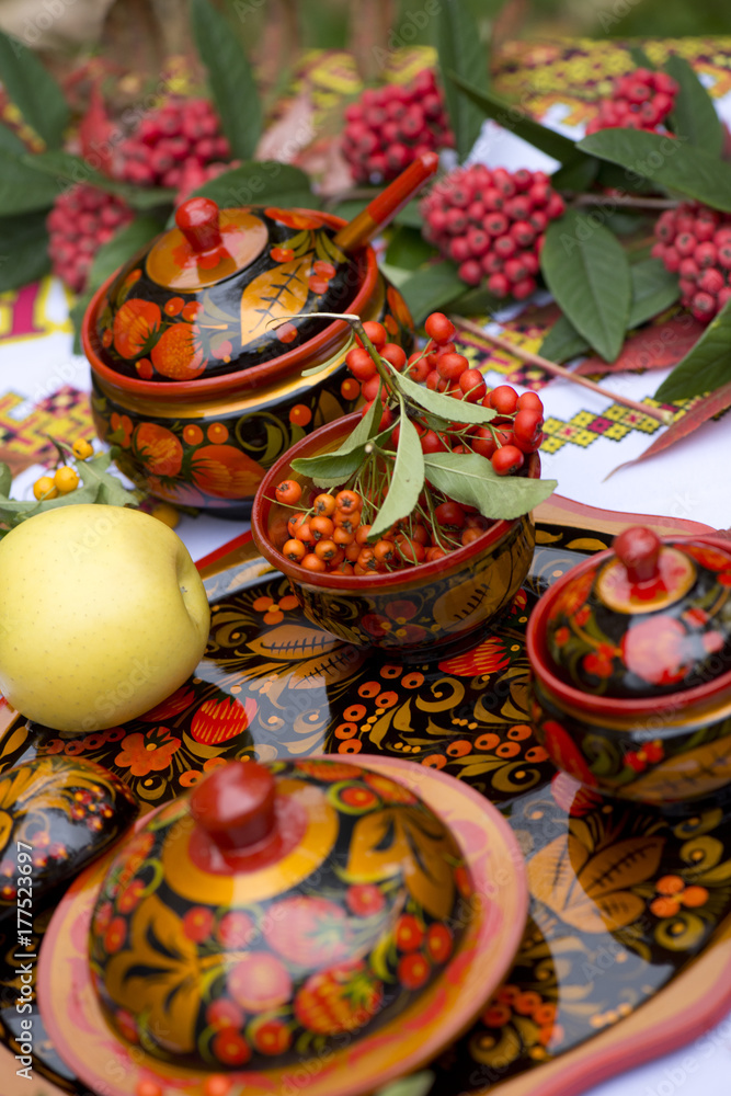 khokhloma dishes autumn patterns Russian color folk craft berry leaves red yellow