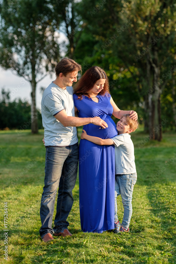 Happy pregnant family of three expecting new baby Happy pregnant family of three expecting new baby