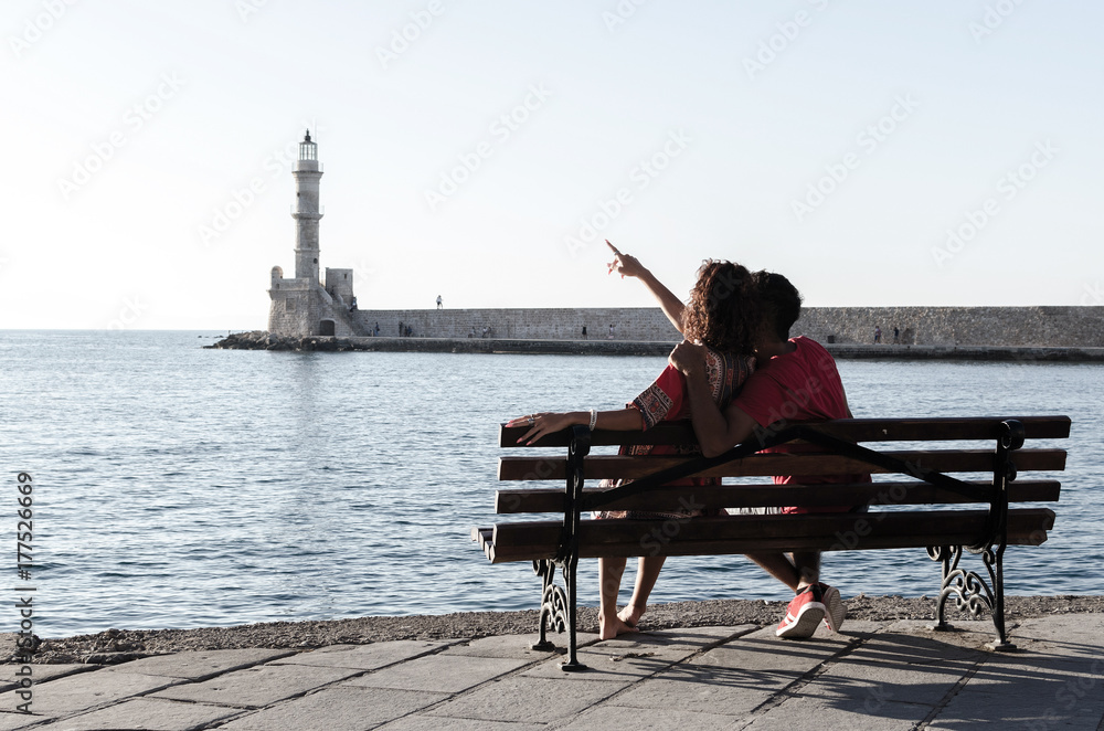 Man and woman watching lighthouse
