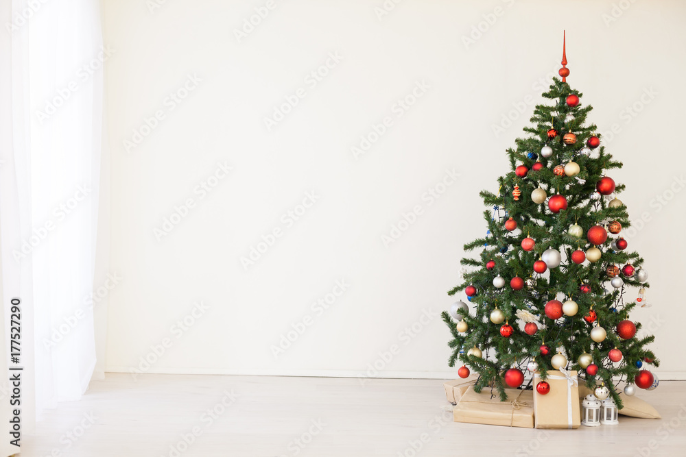 Christmas tree with red gifts in the white room Christmas Christmas tree with red gifts in the white room Christmas