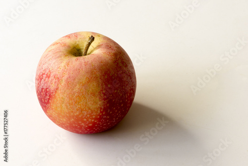 An apple on a color background a white