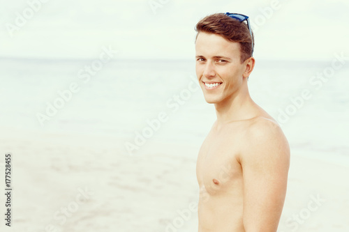 Handsome man posing at beach