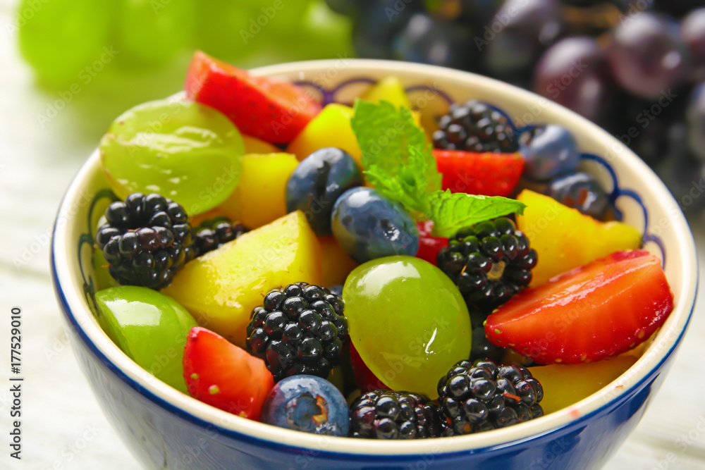 Bowl with delicious fruit salad, closeup Bowl with delicious fruit salad, closeup