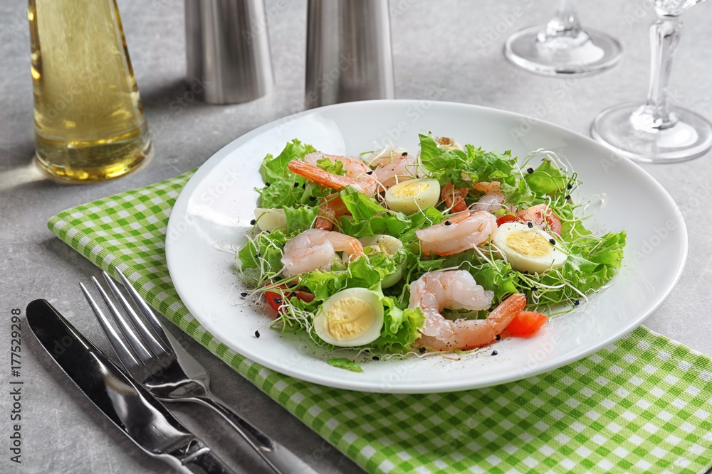 Plate with fresh tasty shrimp salad on table Plate with fresh tasty shrimp salad on table