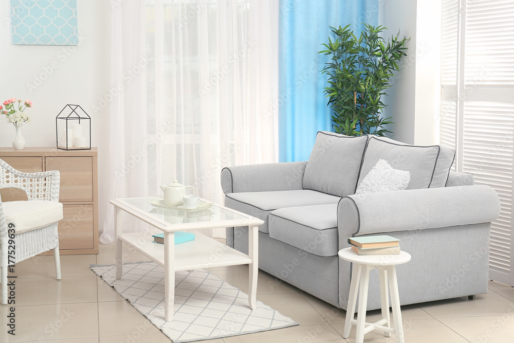 Fototapeta premium Comfortable sofa in living room