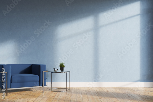 Minimalistic living room, blue armchair