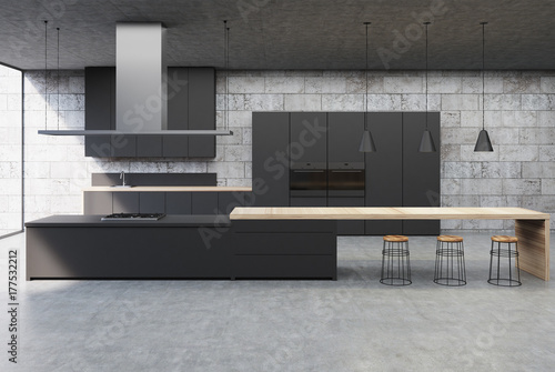 Concrete kitchen interior, black cabinets