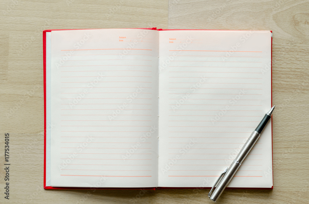 blank notebook with pen on wood table Text input area blank notebook with pen on wood table Text input area