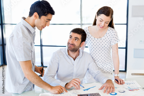 Group of happy young business people in a meeting