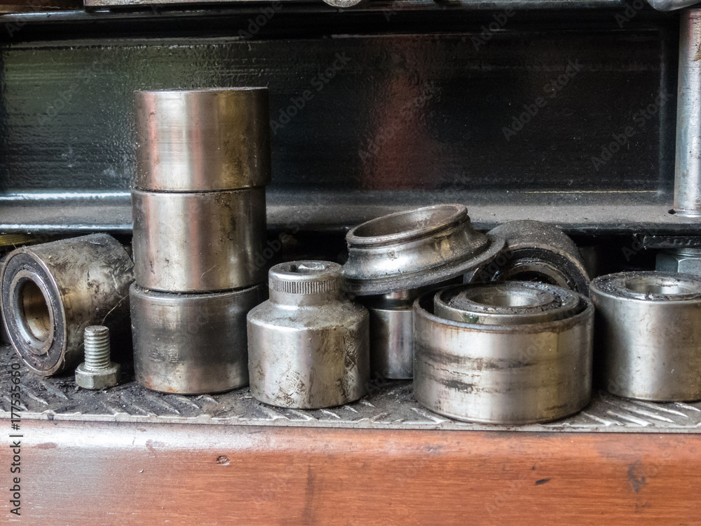 discarded bearings on shelf in mechanic workshop