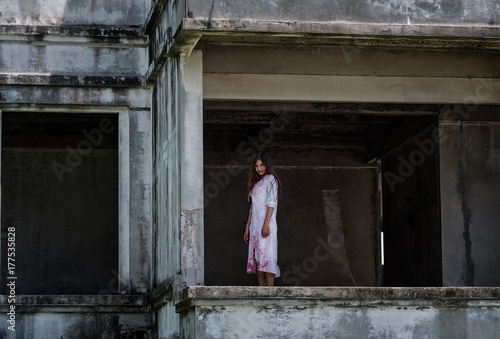 Zombie Ghost woman murder with bloody stand on abandoned building © sorapop
