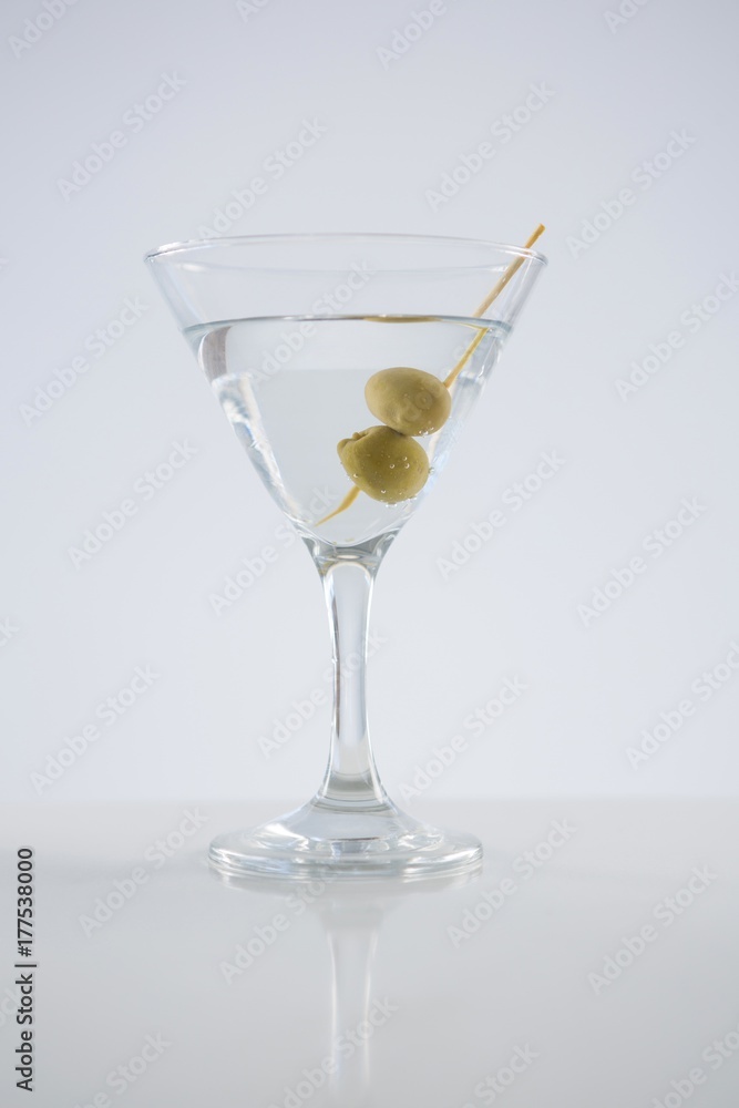 Cocktail martini with olives on table Cocktail martini with olives on table