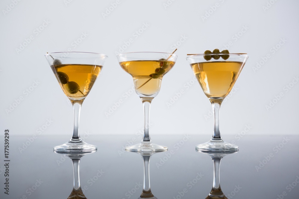 Cocktail with olives on table Cocktail with olives on table
