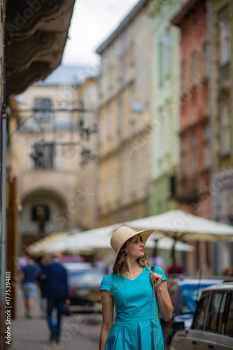 Woman in old city, street background, walking, traveling