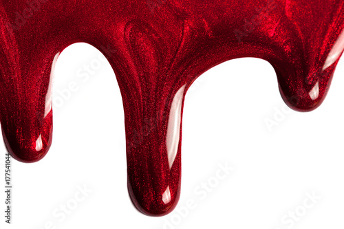 drip red mother of pearl nail Polish.Stylish samples of cosmetics for advertising.