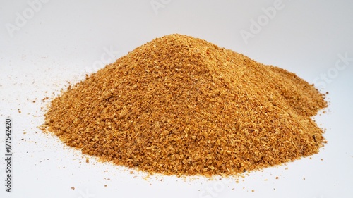 yellow golden of corn ddgs, distillation dried grains soluble onwhite background, raw material of biodiesel , alcohol fermentation and renewable energy , rich protein 