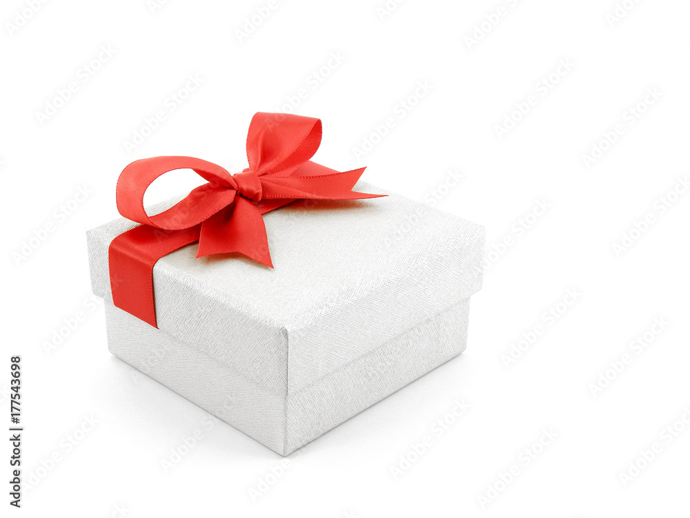 Obraz premium single luxury grey cardboard gift box with red ribbon tied bow isolated on white