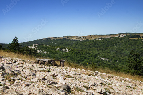 Old wooden bench near the coast of a mountain lake, Krimea