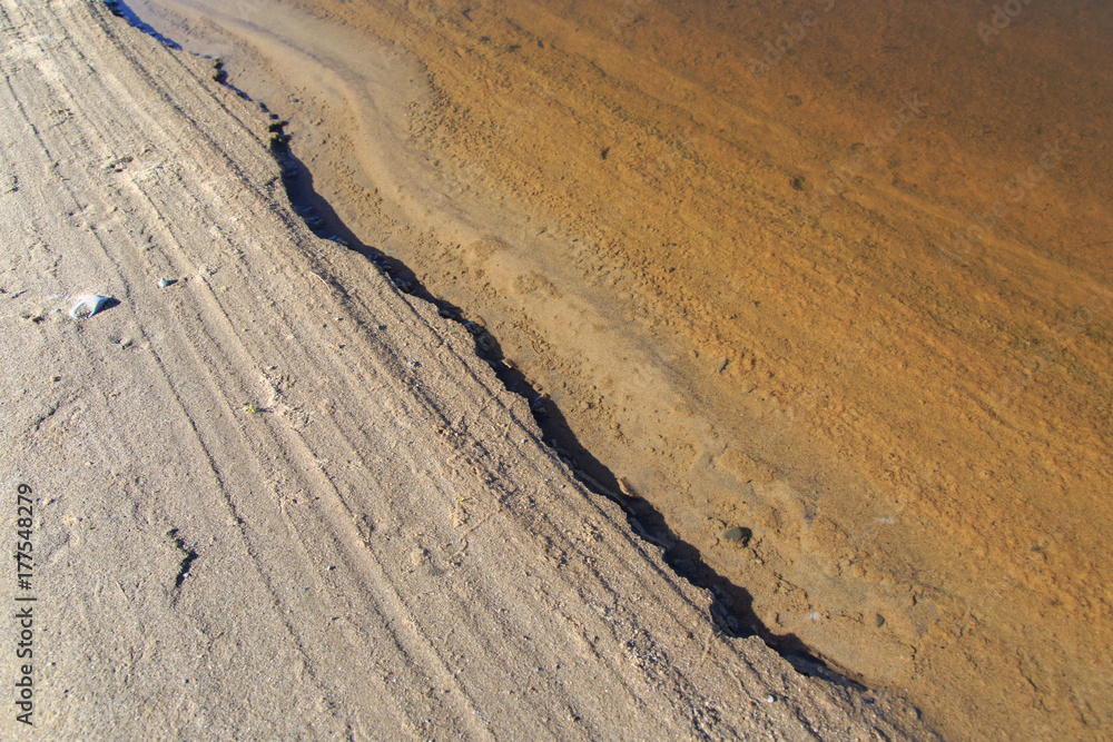 Sandy coastal strip with sharply outlined shade Sandy coastal strip with sharply outlined shade