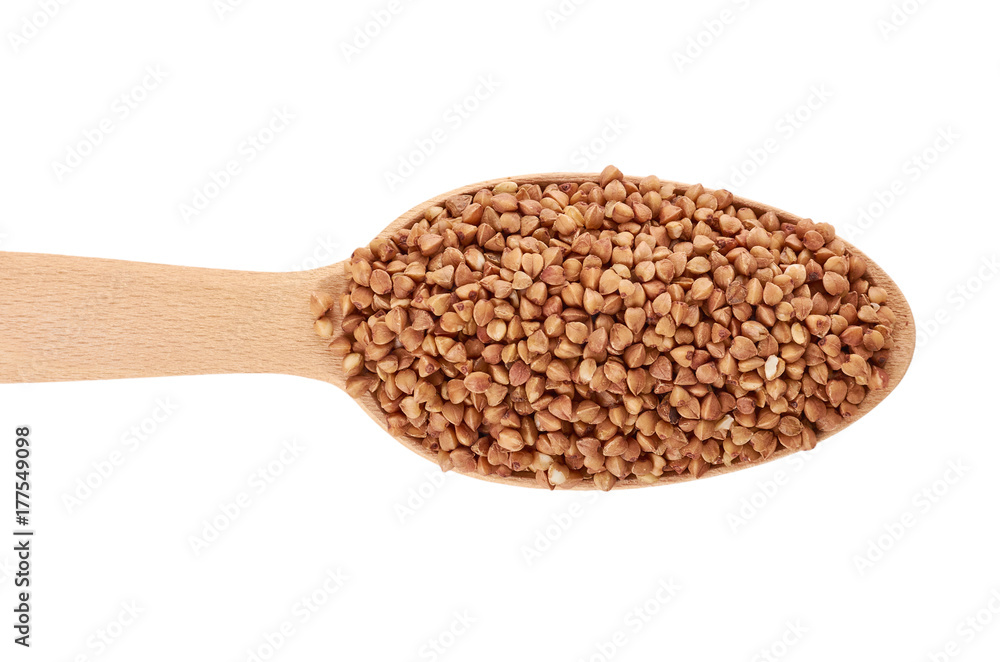 healthy buckwheat grains in wooden spoon isolated on white background healthy buckwheat grains in wooden spoon isolated on white background