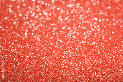 Red (ruby) glitter background. Sparkle texture. Abstract background blurred for New Years or Christmas holiday