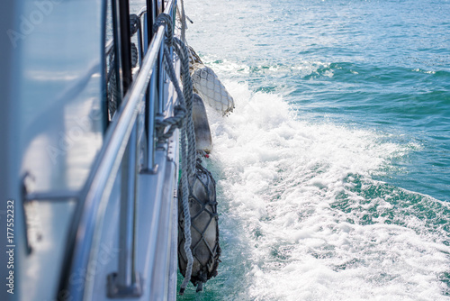 Side Ferry boat floating on the sea.