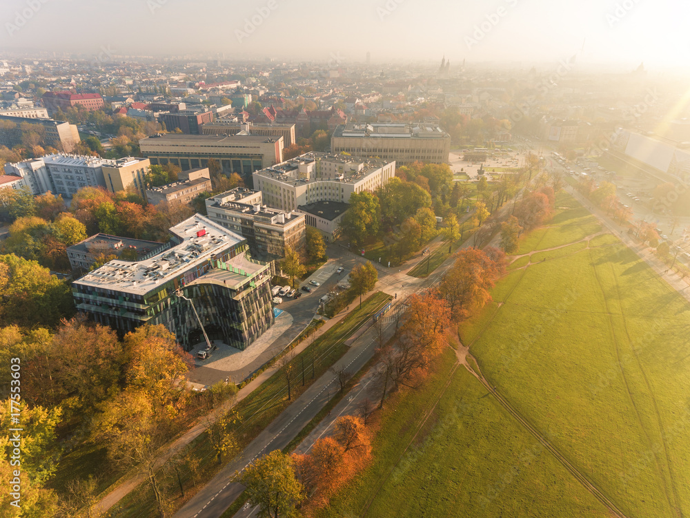Panorama of Krakow, Poland, park and architecture in fall. Aerial view at sunset.