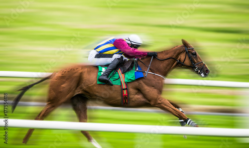 Foto Racing horse and jockey zoom effect speed blur
