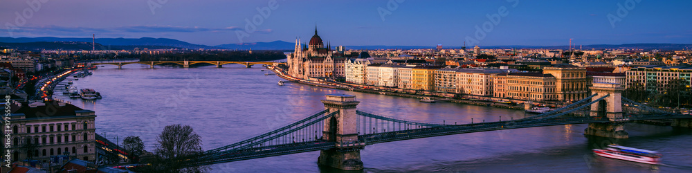 Chain bridge and Parliament building in Budapest, Hungary at sunset