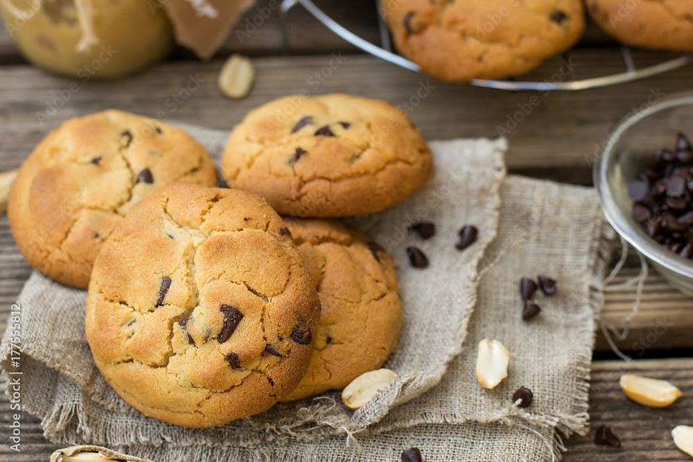 Peanut butter cookies with chocolate chips on wooden background Peanut butter cookies with chocolate chips on wooden background