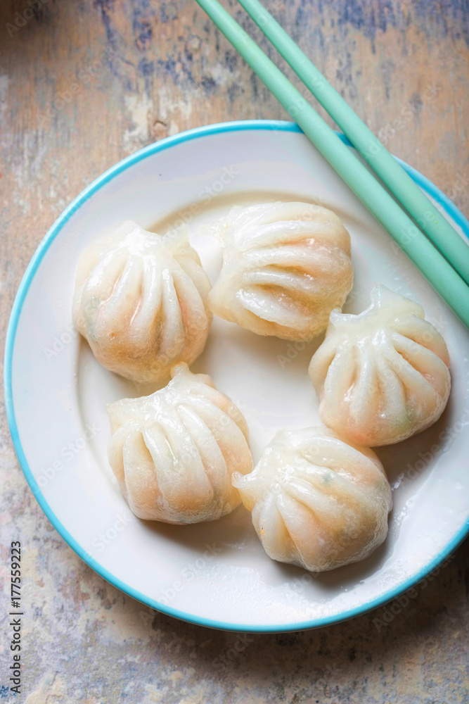 Steamed prawn dim sum. Prawns & oriental vegetables steamed in rice pastry Steamed prawn dim sum. Prawns & oriental vegetables steamed in rice pastry
