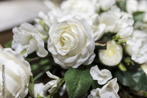 White roses wedding bouquet of flowers shot close up with a shallow depth of field at a tradtional English Wedding