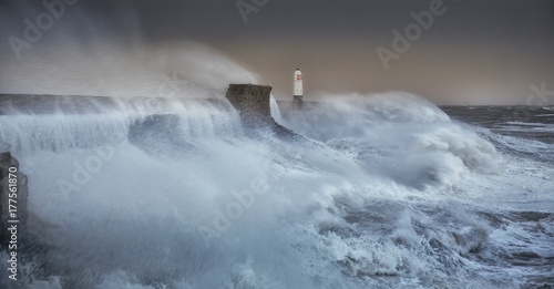 Hurricane Brian The forces of nature engulf the pier and lighthouse as Storm Brian lands on the Porthcawl coast of South Wales, UK.