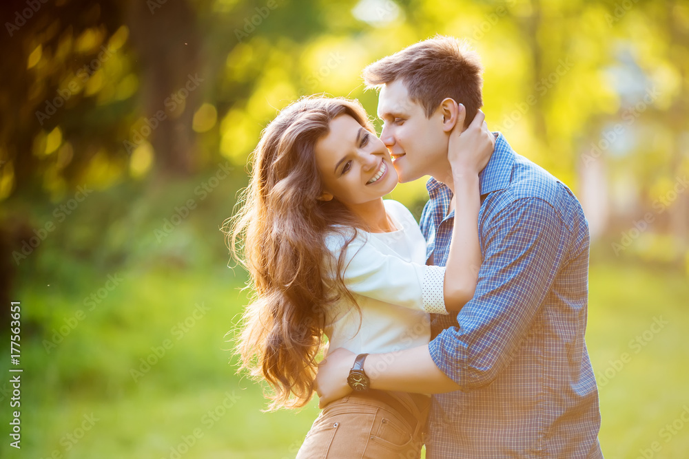 loving couple are hugging in park loving couple are hugging in park
