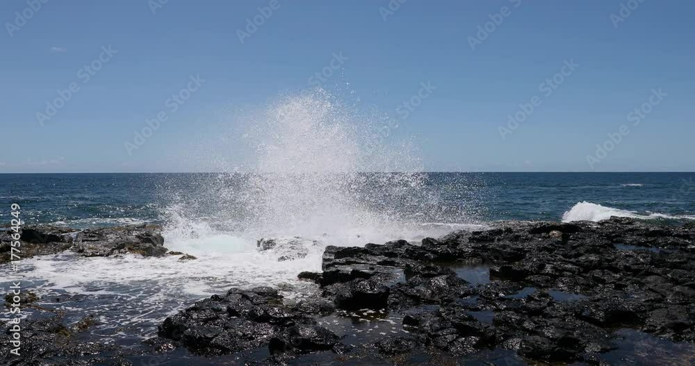 Kauai Hawaii violent rough surf rocky coast. Kauai is the oldest Hawaiian Island. Garden Isle. Economy is tourism based. Water and tropical beach recreation and fun. Beautiful blue ocean sea. Kauai Hawaii violent rough surf rocky coast. Kauai is the oldest Hawaiian Island. Garden Isle. Economy is tourism based. Water and tropical beach recreation and fun. Beautiful blue ocean sea.