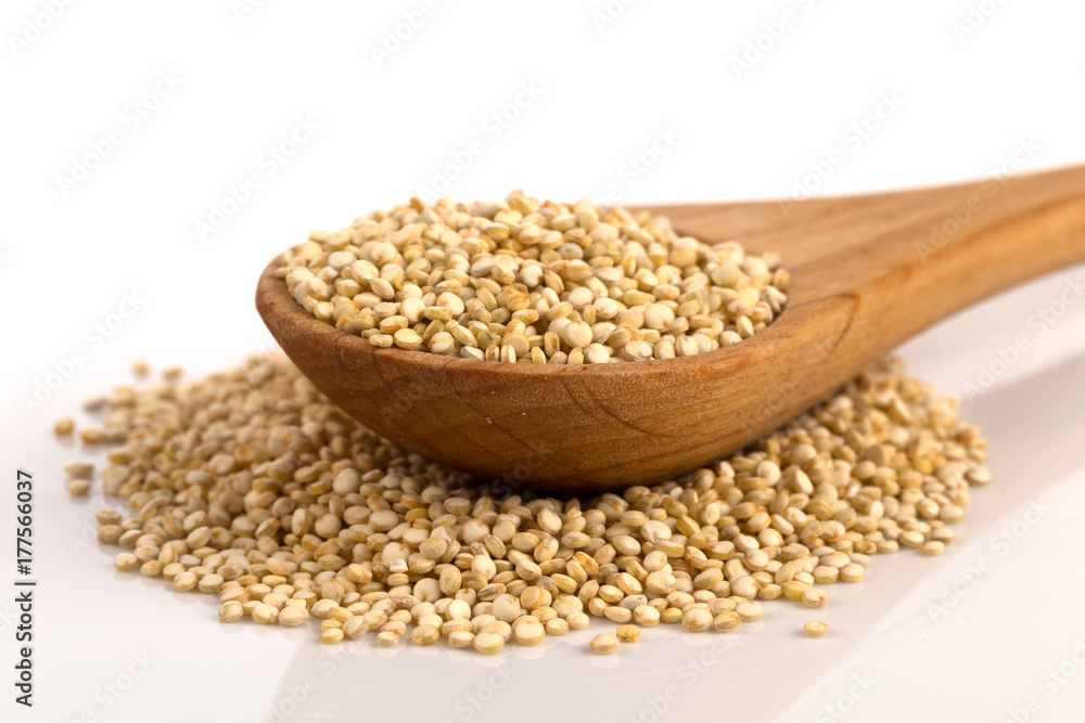 Pile of grain quinoa seeds in spoon Pile of grain quinoa seeds in spoon