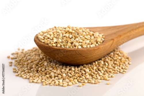 Pile of grain quinoa seeds in spoon