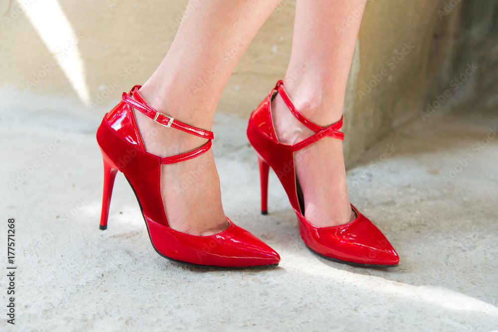 Female legs with red heels